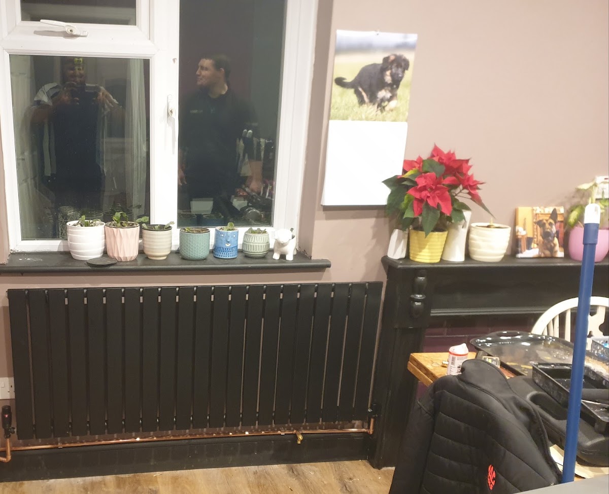 A finished designer radiator installation in a Reading living room